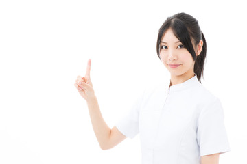young asian nurse showing on white background