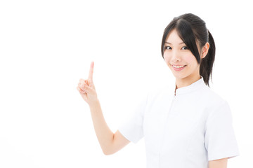 young asian nurse showing on white background