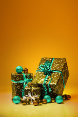 Gift boxes and christmas balls,Isolated on orange background