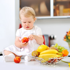 Sweet little girl on a kitchen