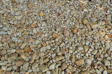 Sea beach. Natural small pebbles on the seashore