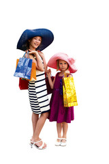 .Two attractive happy girls out shopping