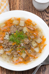 delicious vegetable soup with meatballs, vertical