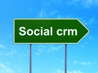 Finance concept: Social CRM on road sign background