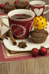 still life with tea mugs and  chocolate muffins with decoration