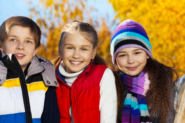 Three happy smiling teen kids