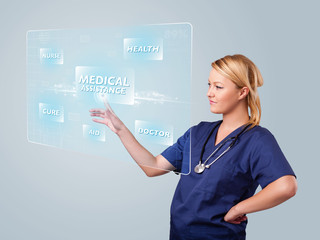 Young nurse pressing modern medical type of buttons