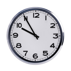 Round office clock shows ten o'clock