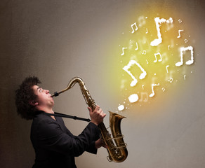 Handsome musician playing on saxophone with musical notes