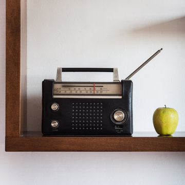 Vintage radio with yellow apple