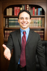 Businessman giving an handshake