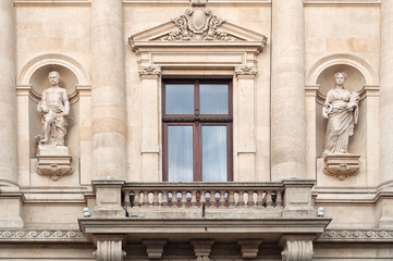 Window with balcony and statues