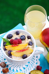 Oatmeal in cup with berries