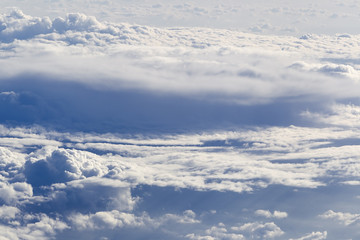 Fototapeta na wymiar Cloud formations seen from the plane