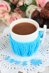 Cup with knitted thing on it close up