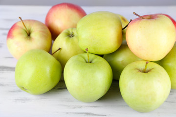 Juicy apples on wooden table