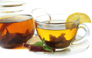 Cup and teapot of green tea closeup