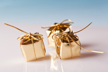 golden christmas gift boxes on blue background