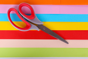 Colorful cardboard and scissors close-up