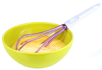 Corolla and broken eggs in bowl isolated on white