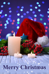 Candles and Christmas decoration on bright background