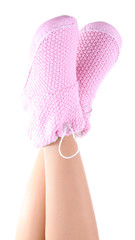 Female legs in home winter shoes, isolated on white