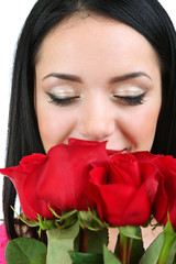 Attractive young woman with roses isolated on white