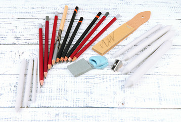 Professional art materials, on wooden table