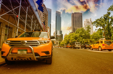 Yellow Cabs in New York. Taxis speeding up near Central Park in