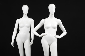 Two mannequin woman isolated on black