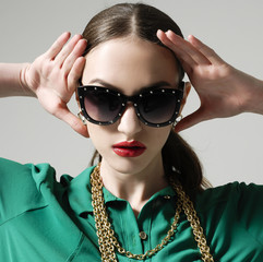 portrait of young gorgeous caucasian woman wearing sunglasses