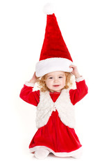 little girl in a cap of Santa Claus isolated on white background