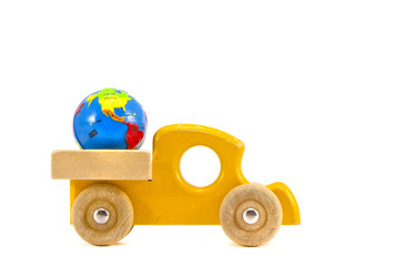 wooden car toy with Earth globe symbol isolated on white