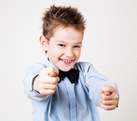 Little boy  showing a fig