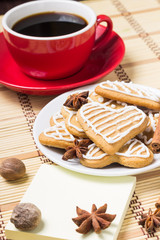 Cup of coffee with gingerbread cookies