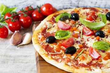 Pizza - Italian pizza with salami and black olives