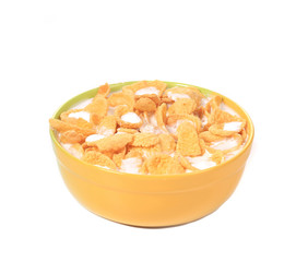 Bowl of corn flakes with milk isolated on white