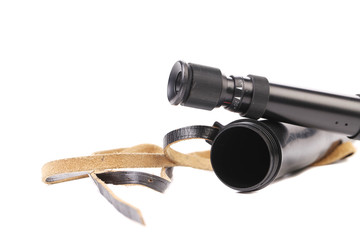 Black cover and spyglass lying.