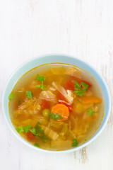 vegetable soup in blue small bowl