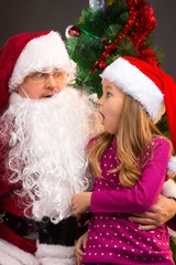girl looking at fake Santa Claus with fake beard
