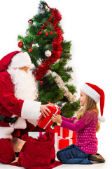 Santa Claus in red costume giving present from the bag.