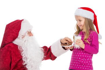 Beautiful blond girl treating Santa Claus with