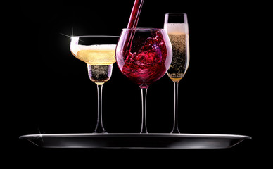 set with different drinks on black background
