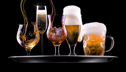 set with different drinks on black background