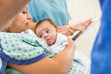Fototapeta premium Babygirl With Loving Mother In Hospital