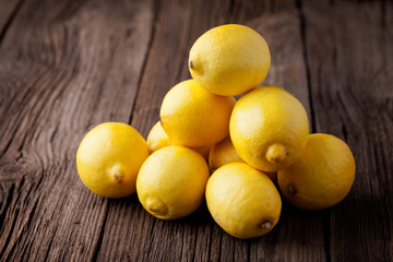 Fresh lemons on a wooden table