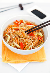 Rice noodles with vegetables in a white bowl