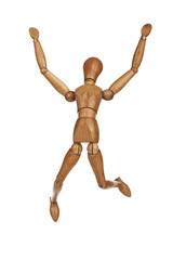 Happy wooden dummy in jump action isolated on white background