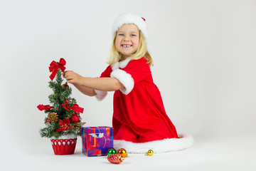 Happy girl in a red Christmas costume