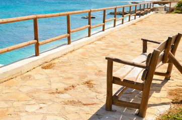 empty bench overlooking the sea